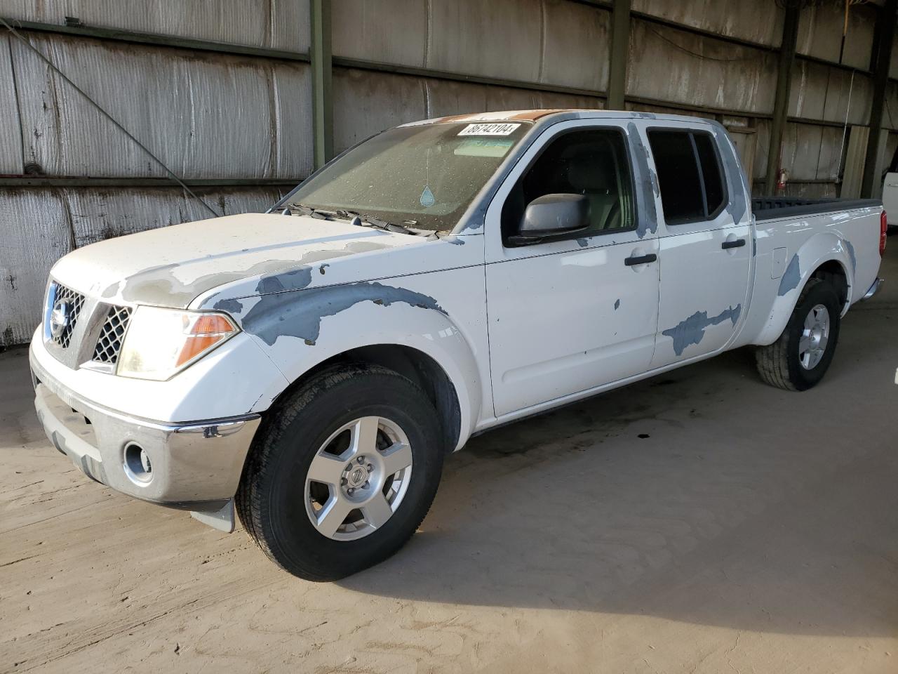 2007 Nissan Frontier Crew Cab Le VIN: 1N6AD09U47C411938 Lot: 86742104